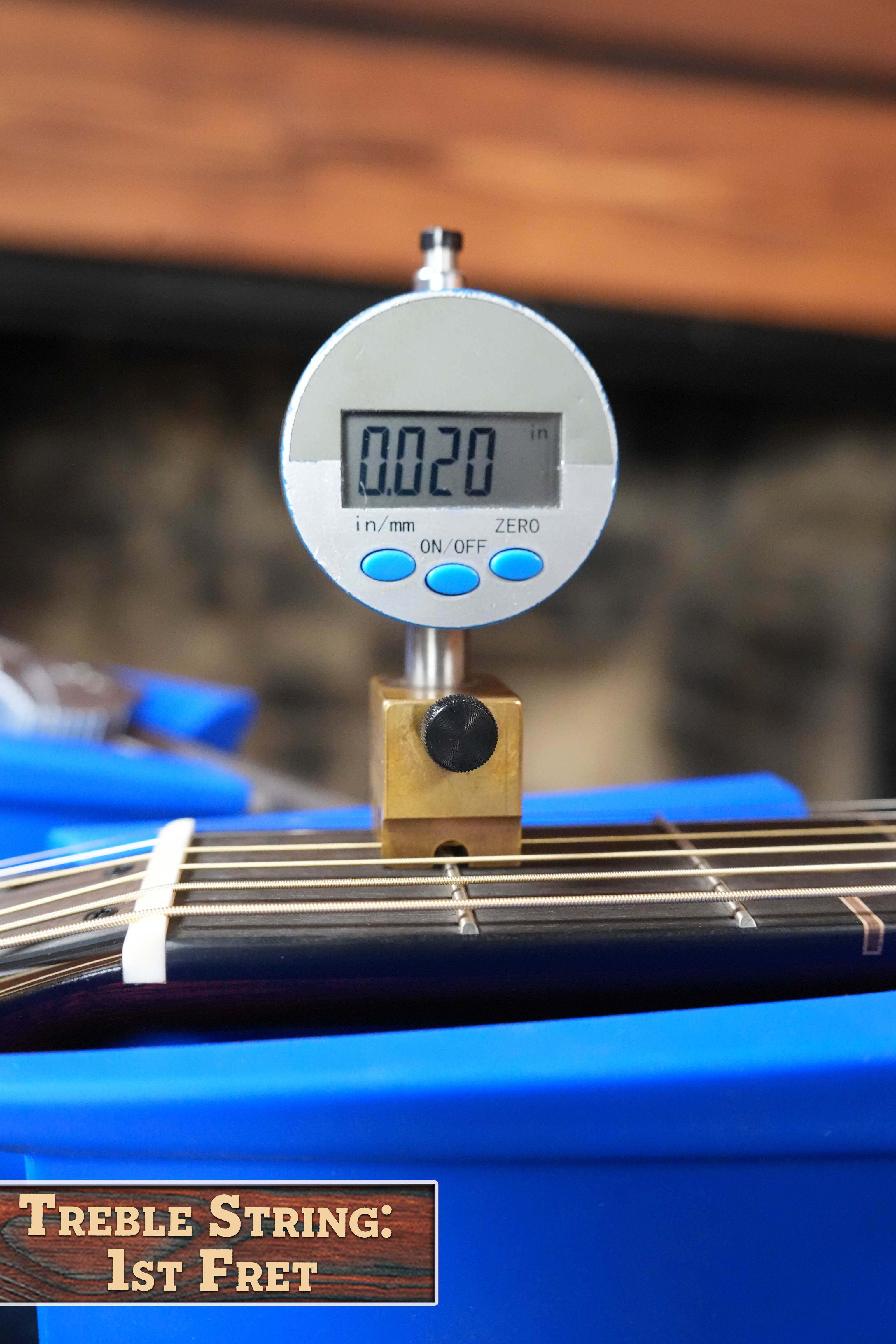 A digital gauge reads 0.020 inches for string height at the first fret of a Yamaha FG9 M Adirondack/Mahogany Dreadnought Acoustic Guitar #112A. "Treble String: 1st Fret" is shown at the bottom left. Brand: Yamaha.