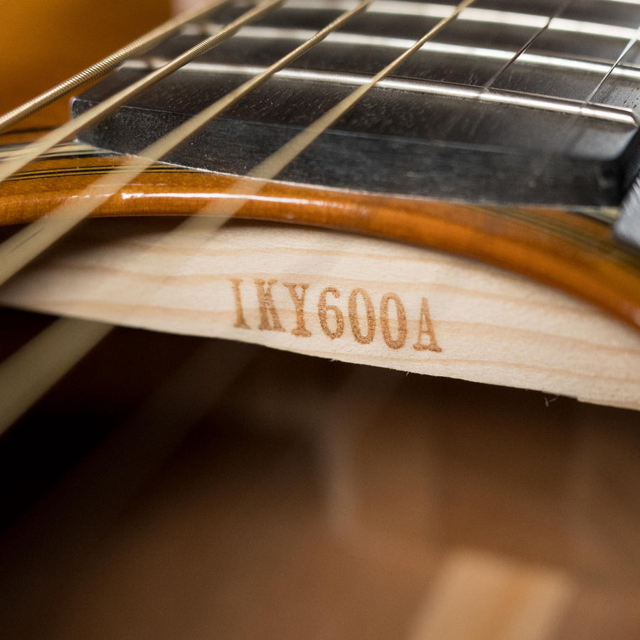 Close-up of Yamaha FS5 GL acoustic guitar interior label showing model number 1KY600A through soundhole. - Yamaha FS5 GL New GLOSS Red Label Sitka/Mahogany Concert Acoustic Guitar #600A - Default Title
