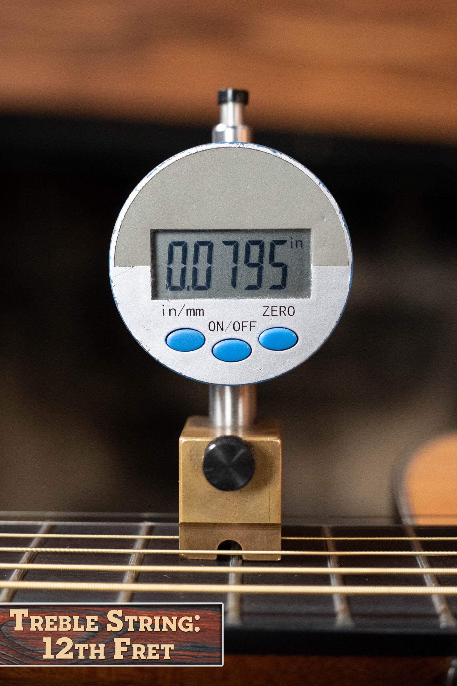 A digital gauge reads 0.0795 on the treble string at the 12th fret of a Yamaha GigMaker Deluxe Acoustic Pack - Natural Finish #8229 guitar, with a Treble String: 12th Fret label visible in the corner.