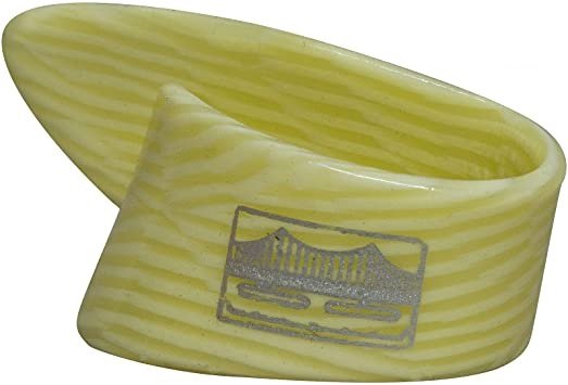 The Golden Gate GP-10 Ivoroid Thumb Pick - LARGE features a curved, guitar pick-inspired design with yellow stripes and a printed bridge image on its surface.