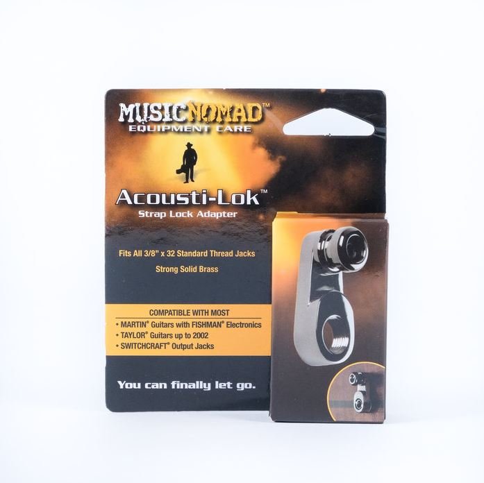 The Music Nomad Acousti-Lok Strap Lock Adapter for Standard Output Jacks (MN270) is shown in its packaging, revealing the metal adapter and product details against a bold black and orange backdrop.